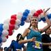 A runner waves to the crowd at the start of the Ann Arbor Marathon on Sunday, June 9. Daniel Brenner I AnnArbor.com